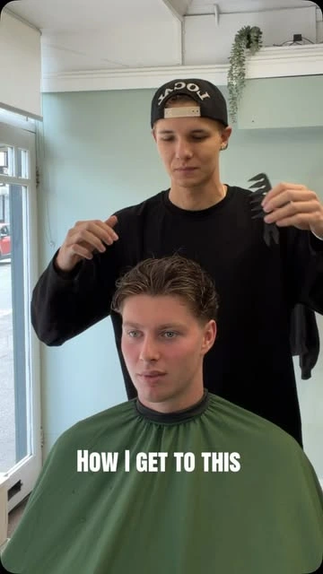 Rab styling a client’s hair at Escobarber — The Studio