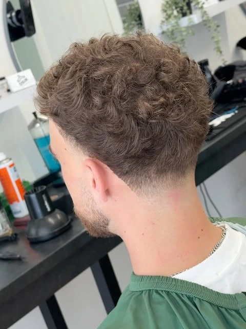 Natural curls and a tapered neckline, cut by Rab